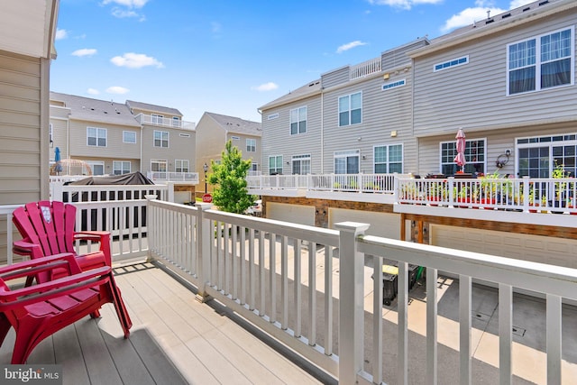 7204 Wood Trail Dr, Lanham, MD 20706 - wooden deck featuring a residential view and an attached garage