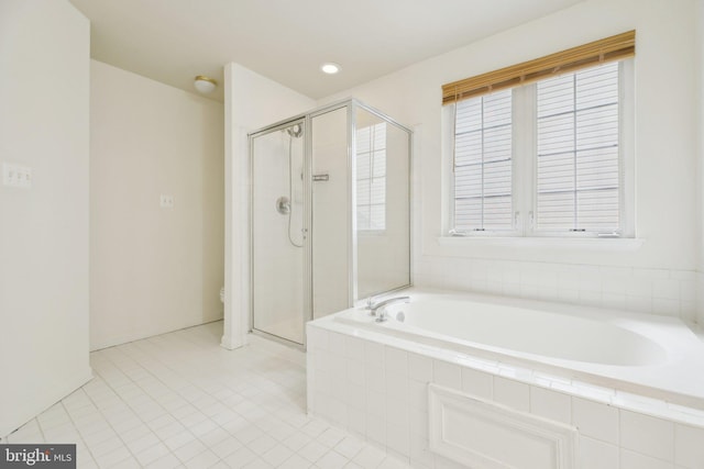 bathroom featuring tile patterned floors, a garden tub, toilet, and a stall shower
