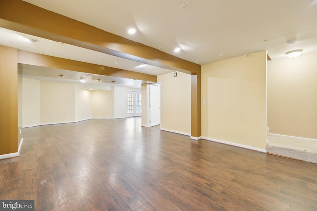 interior space with wood finished floors and baseboards
