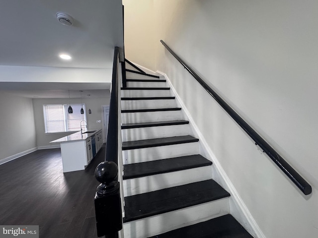 110 N Mount Olivet Ln, Baltimore, MD 21229 - stairs featuring wood finished floors, baseboards, and recessed lighting