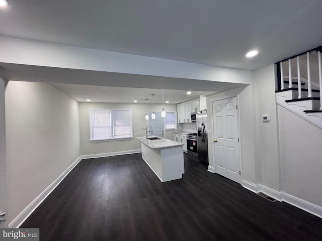 110 N Mount Olivet Ln, Baltimore, MD 21229 - kitchen with stainless steel appliances, dark wood-style floors, baseboards, and light countertops