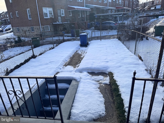 110 N Mount Olivet Ln, Baltimore, MD 21229 - yard layered in snow with fence