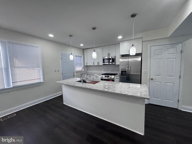 110 N Mount Olivet Ln, Baltimore, MD 21229 - kitchen with a sink, visible vents, baseboards, and appliances with stainless steel finishes