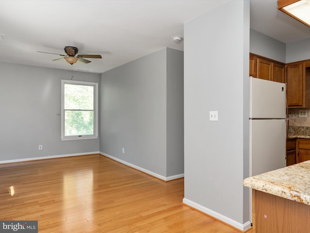 1161 Bacon Ridge Rd, Crownsville, MD 21032 - unfurnished living room featuring ceiling fan, light wood-style floors, and baseboards