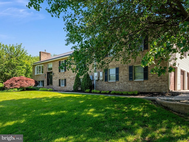 1161 Bacon Ridge Rd, Crownsville, MD 21032 - view of front of home featuring brick siding, a chimney, a front lawn, and a garage