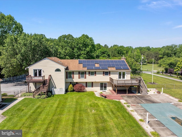 1161 Bacon Ridge Rd, Crownsville, MD 21032 - back of property with stairs, a deck, solar panels, and a covered pool