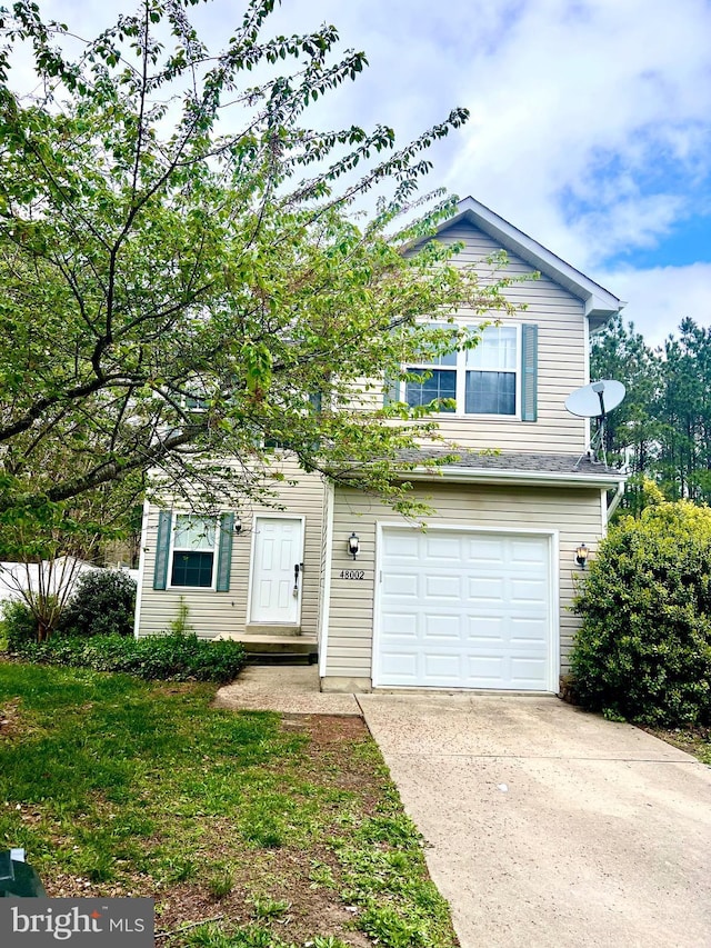 view of front of home with an attached garage and driveway