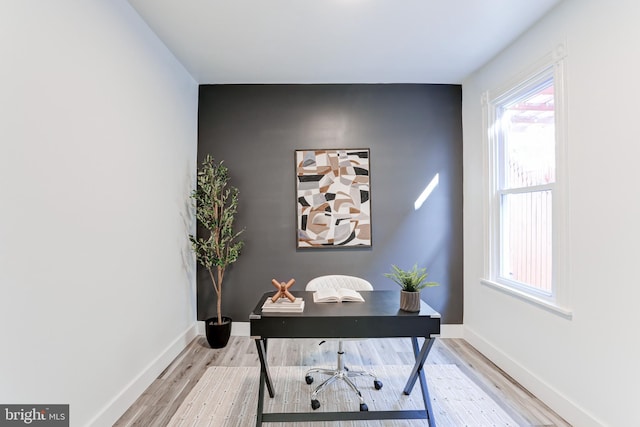 office with baseboards and wood finished floors