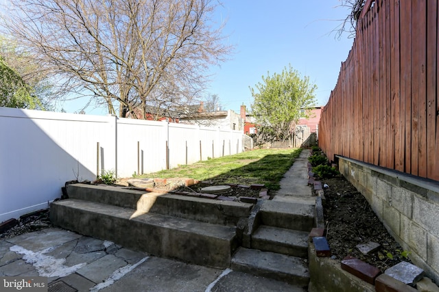 view of yard with a fenced backyard