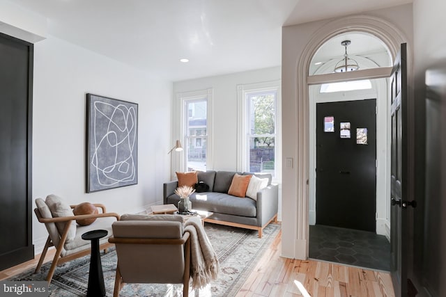 foyer entrance with light wood-style floors and recessed lighting