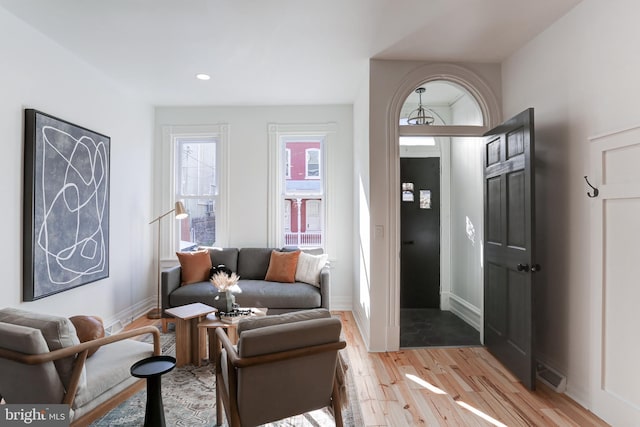 sitting room featuring baseboards, visible vents, light wood finished floors, and recessed lighting