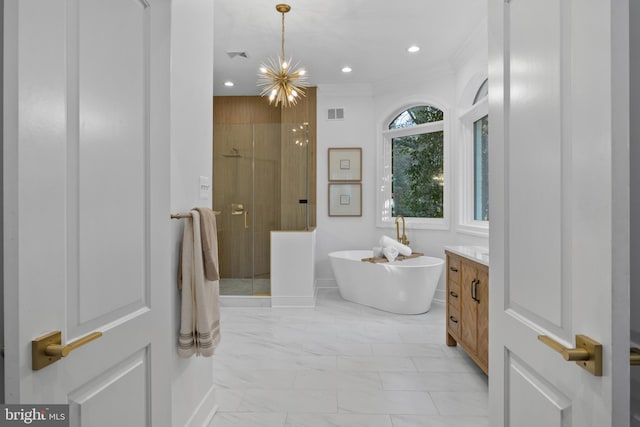 bathroom featuring recessed lighting, a freestanding tub, marble finish floor, and a shower stall