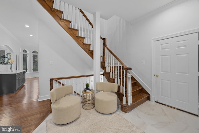 interior space with stairway, baseboards, crown molding, and recessed lighting