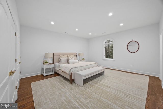 bedroom with recessed lighting, baseboards, visible vents, and dark wood-style floors