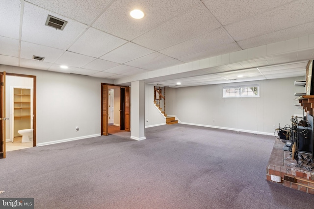 8601 Pretoria Ct, Clinton, MD 20735 - below grade area with stairway, baseboards, visible vents, and carpet