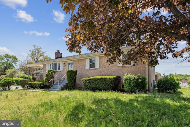 8601 Pretoria Ct, Clinton, MD 20735 - view of front of house with a chimney and brick siding