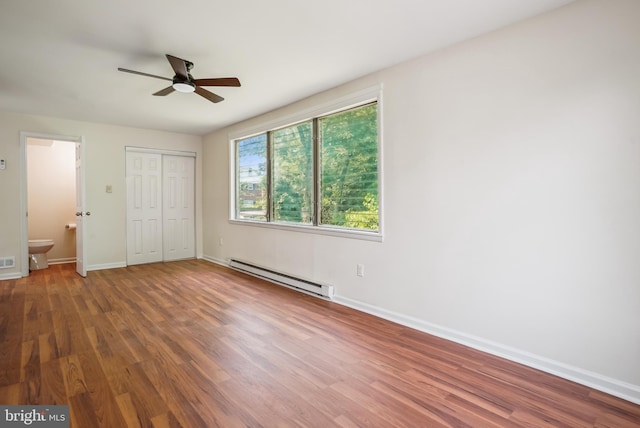 2305 Houston St, Suitland, MD 20746 - unfurnished bedroom featuring a baseboard radiator, wood finished floors, a closet, and ceiling fan