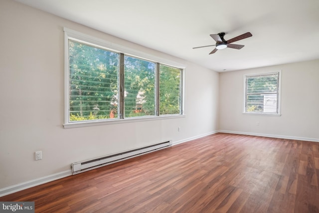 2305 Houston St, Suitland, MD 20746 - unfurnished room with a baseboard heating unit, wood finished floors, and a ceiling fan