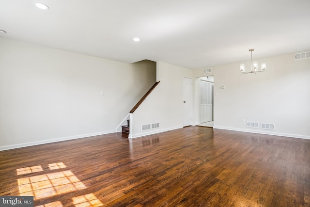 2305 Houston St, Suitland, MD 20746 - unfurnished living room with a chandelier, wood finished floors, stairway, and recessed lighting
