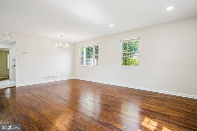 2305 Houston St, Suitland, MD 20746 - unfurnished room with a chandelier, dark wood-style flooring, and recessed lighting
