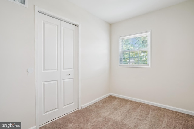 2305 Houston St, Suitland, MD 20746 - unfurnished bedroom with carpet and a closet