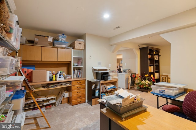 office space with visible vents and washer / clothes dryer