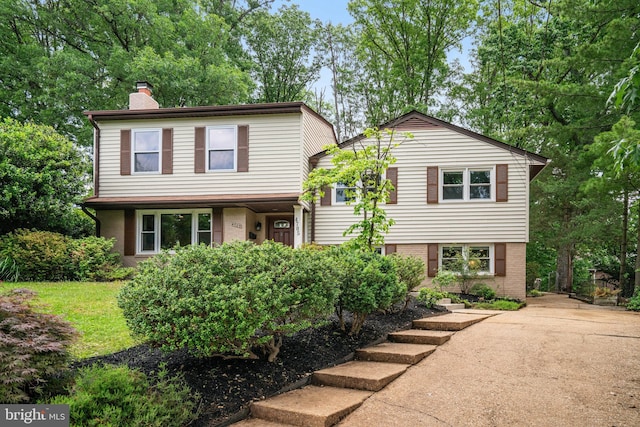 4705 Exeter St, Annandale, VA 22003 - tri-level home with a chimney and brick siding