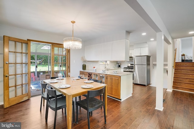 4705 Exeter St, Annandale, VA 22003 - dining area featuring stairs, a chandelier, dark wood finished floors, and recessed lighting
