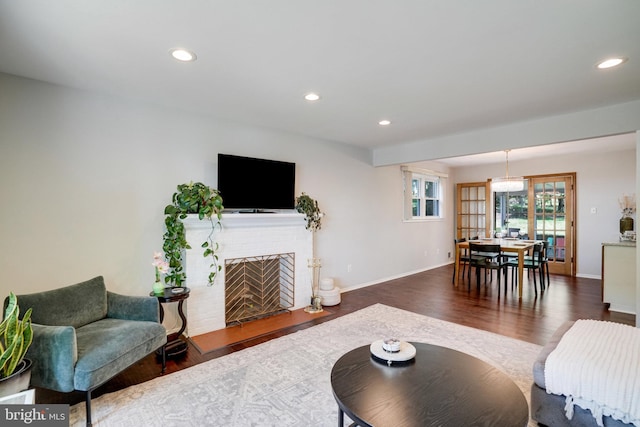 4705 Exeter St, Annandale, VA 22003 - living room featuring wood finished floors, recessed lighting, baseboards, and a brick fireplace
