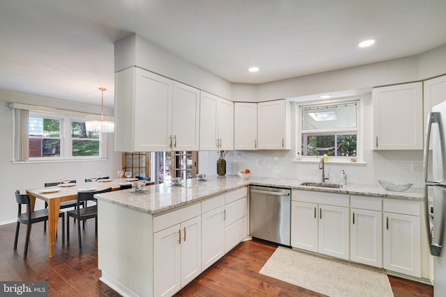 4705 Exeter St, Annandale, VA 22003 - kitchen featuring appliances with stainless steel finishes, a sink, healthy amount of natural light, a peninsula, and recessed lighting