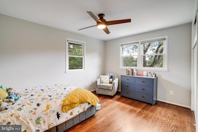 4705 Exeter St, Annandale, VA 22003 - bedroom featuring multiple windows, wood finished floors, baseboards, and ceiling fan