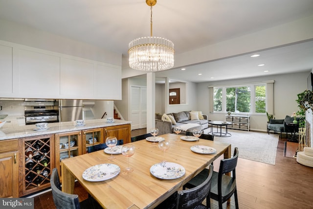4705 Exeter St, Annandale, VA 22003 - dining area with stairway, wood finished floors, recessed lighting, and a chandelier