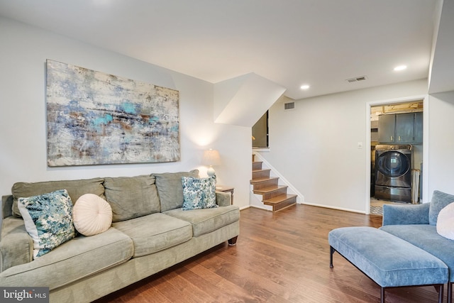 4705 Exeter St, Annandale, VA 22003 - living room with washer / clothes dryer, wood finished floors, stairs, recessed lighting, and baseboards