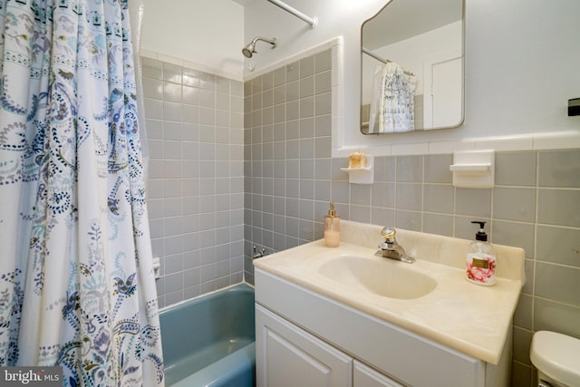 4705 Exeter St, Annandale, VA 22003 - bathroom with shower / tub combo with curtain, vanity, toilet, and tile walls