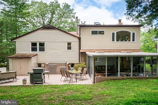 4705 Exeter St, Annandale, VA 22003 - back of house featuring a deck, a sunroom, a yard, and a chimney