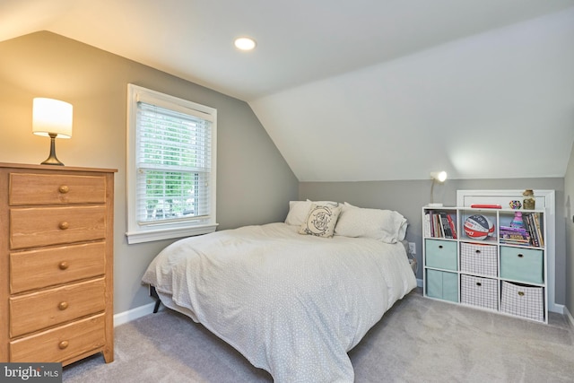 bedroom featuring carpet, baseboards, and lofted ceiling