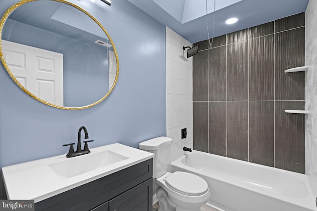 bathroom with toilet, vanity, shower / washtub combination, and visible vents