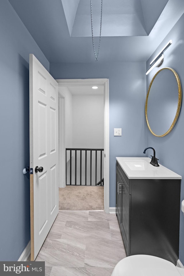 bathroom featuring vanity and baseboards