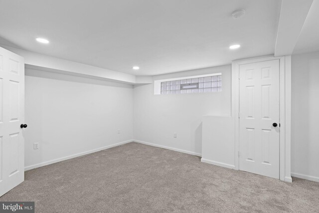 below grade area with baseboards, recessed lighting, and carpet flooring