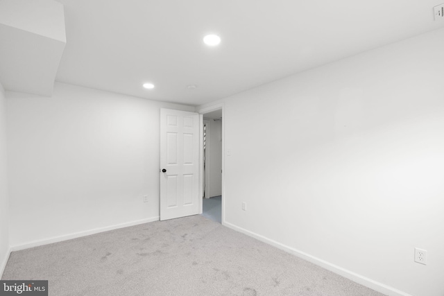 empty room with visible vents, baseboards, carpet, and recessed lighting