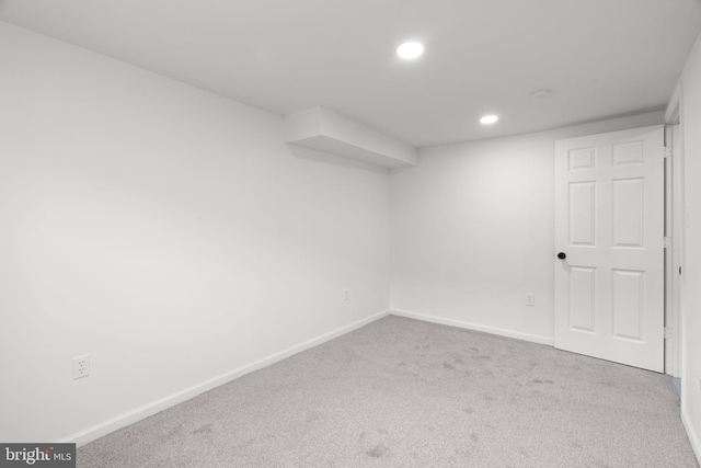 finished basement featuring carpet floors, baseboards, and recessed lighting