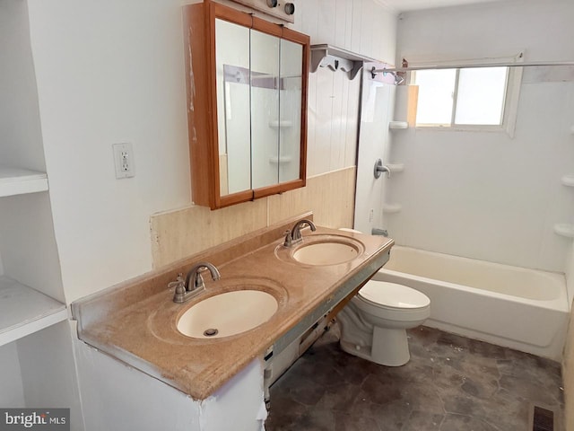 full bathroom with double vanity, toilet, shower / bathtub combination, and a sink