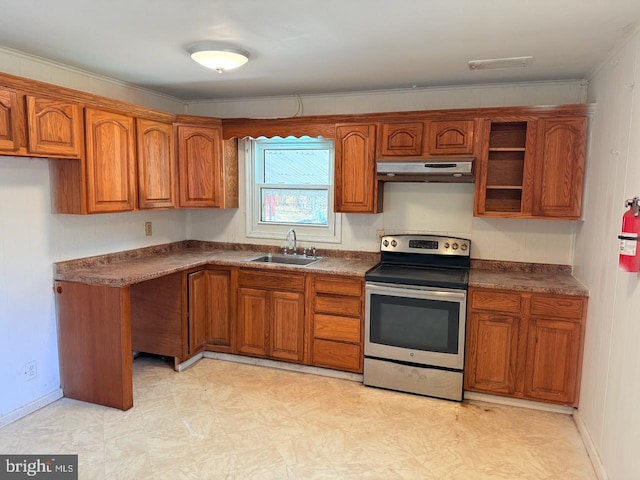 kitchen with electric range, dark countertops, brown cabinets, a sink, and under cabinet range hood