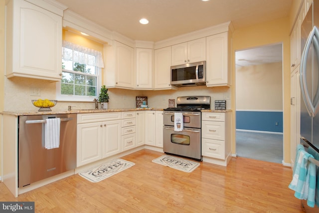 3713 Parkhurst Way, Baltimore, MD 21236 - kitchen with stainless steel appliances, light wood finished floors, light stone countertops, a sink, and recessed lighting