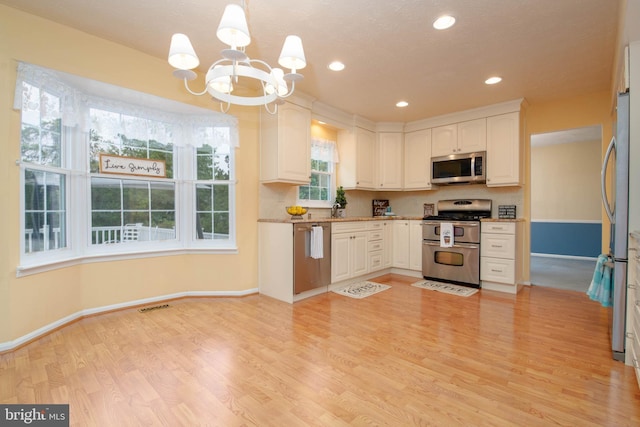 3713 Parkhurst Way, Baltimore, MD 21236 - kitchen featuring appliances with stainless steel finishes, baseboards, a chandelier, light wood-type flooring, and recessed lighting
