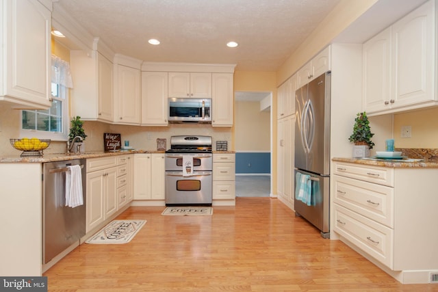 3713 Parkhurst Way, Baltimore, MD 21236 - kitchen featuring stainless steel appliances, light wood-style floors, recessed lighting, light stone countertops, and white cabinetry