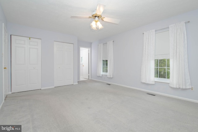 3713 Parkhurst Way, Baltimore, MD 21236 - unfurnished bedroom featuring light carpet, baseboards, and multiple closets