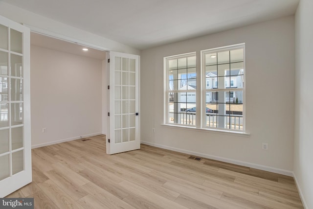 224 Camwood Ct, Fredericksburg, VA 22405 - unfurnished room featuring french doors, baseboards, visible vents, and wood finished floors
