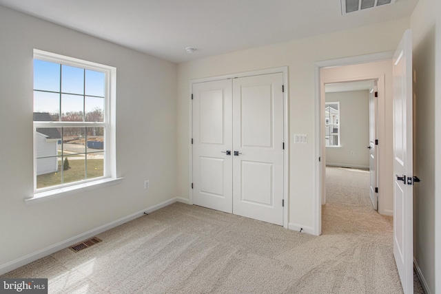224 Camwood Ct, Fredericksburg, VA 22405 - unfurnished bedroom with visible vents, baseboards, a closet, and carpet