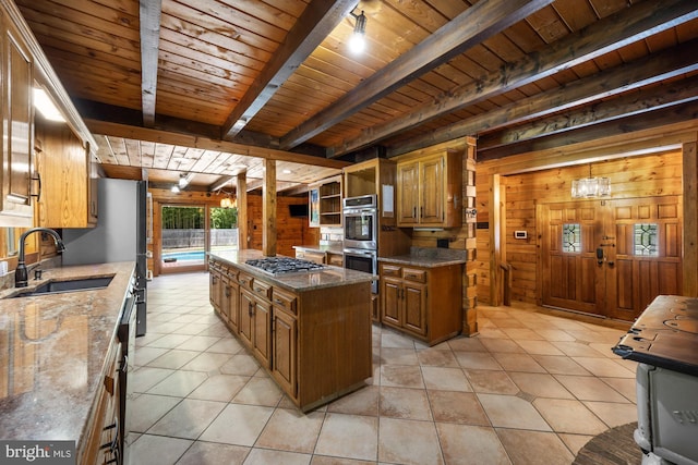 74 Madison Rd, Elmer, NJ 08318 - kitchen with stainless steel appliances, a sink, wooden ceiling with exposed beams, wood walls, and brown cabinetry